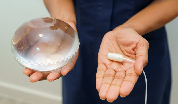 Staff member holding an allurion gastric balloon