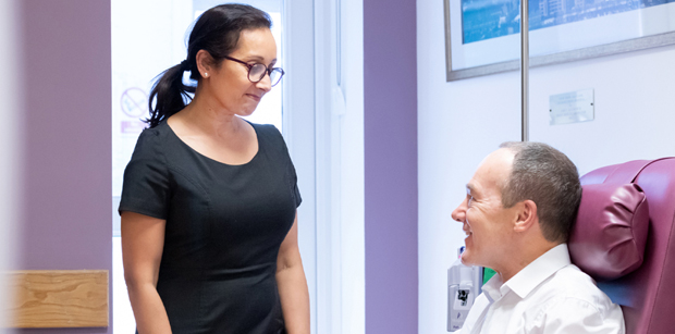 Photo of man and woman in hospital waiting room