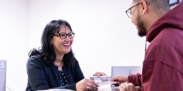 Receptionist talking to a patient