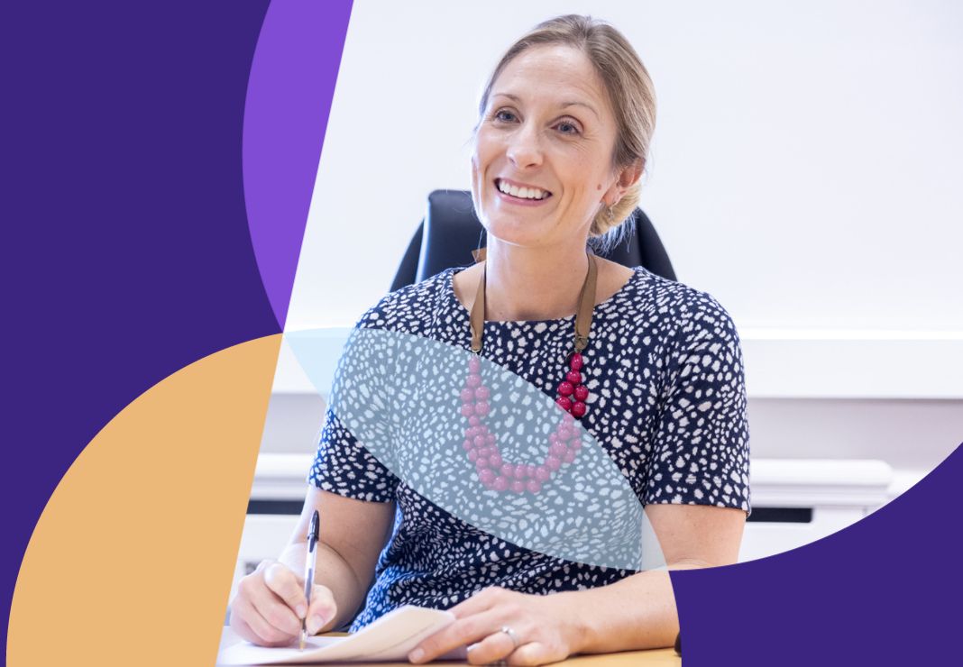 Consultant writing notes looking at patient