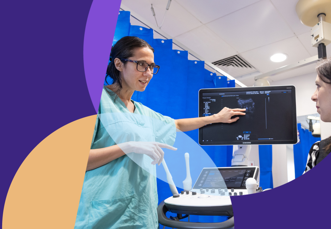 Gynaecology surgeon with patient talking through scan