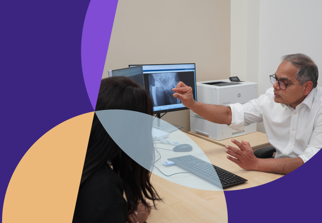 Satya Naique consultant with a patient during a consultation