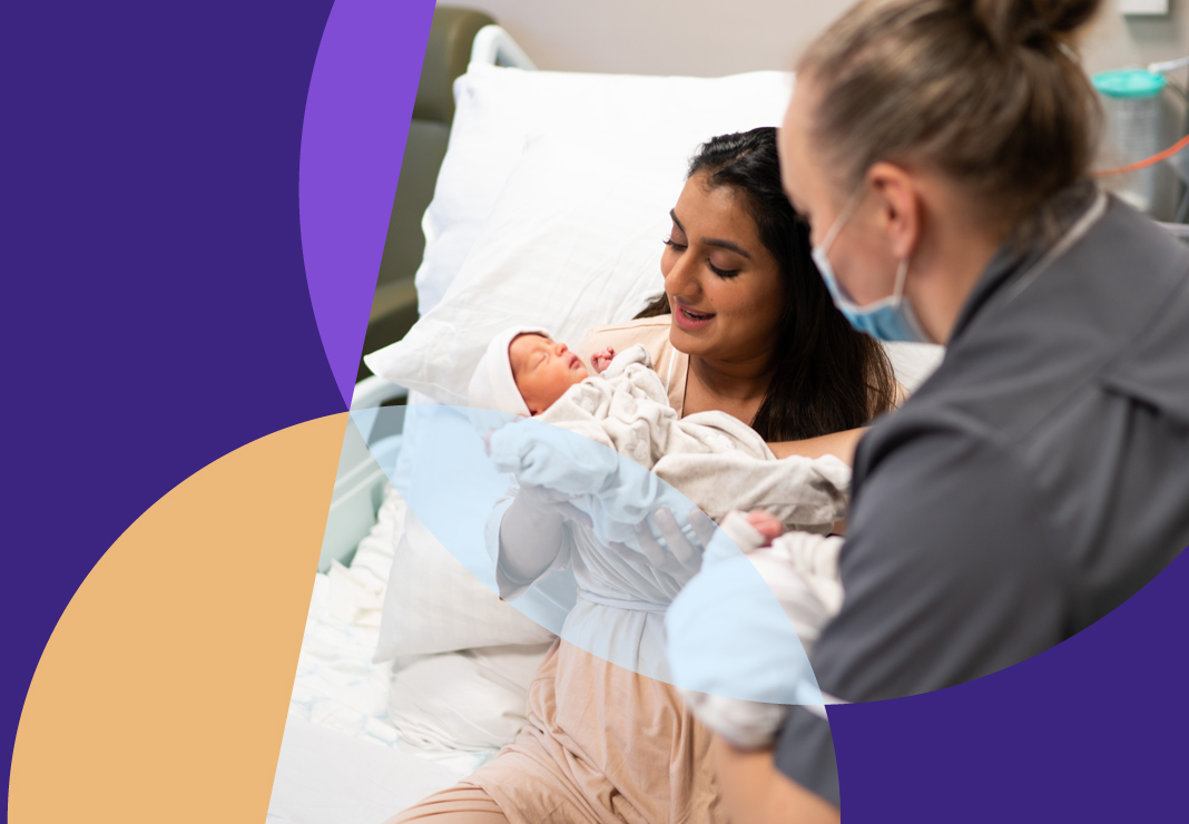 Nurse interacting with a mother and newborn