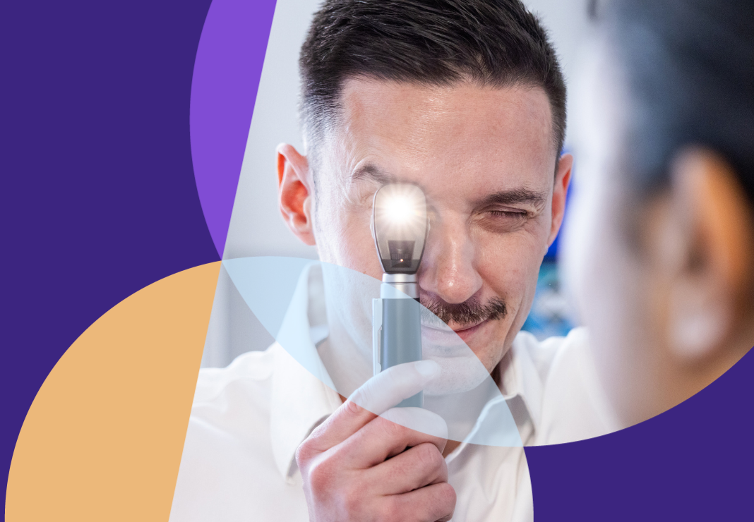 Ophthalmologist examining patient with eye torch