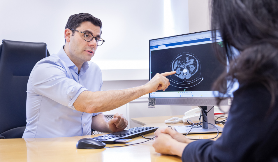 Urologist Hamid Abboudi with patient