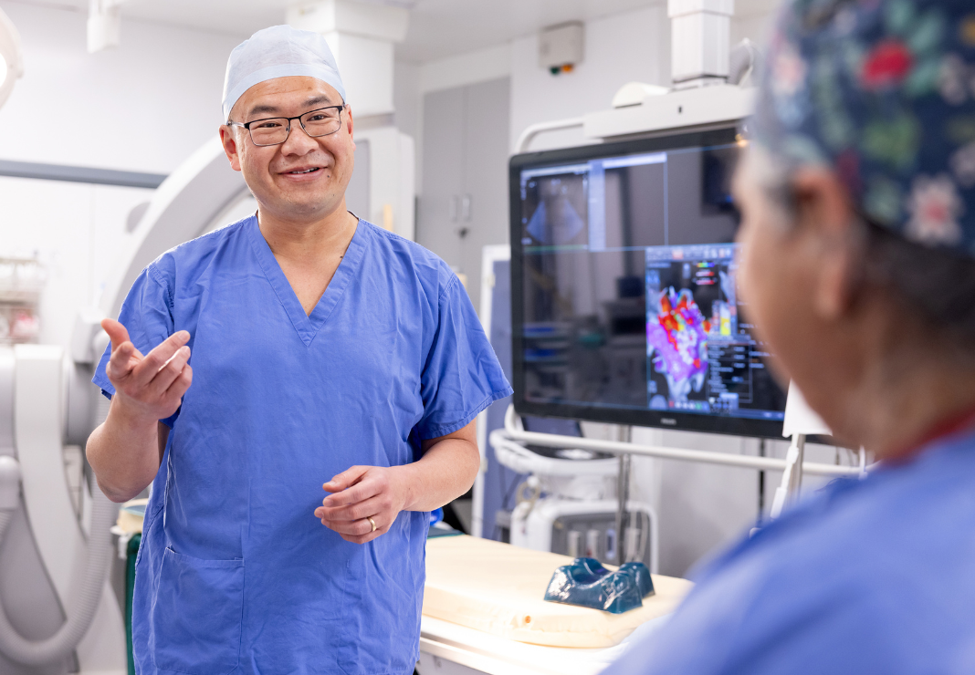 Heart surgeon with consultant in theatre