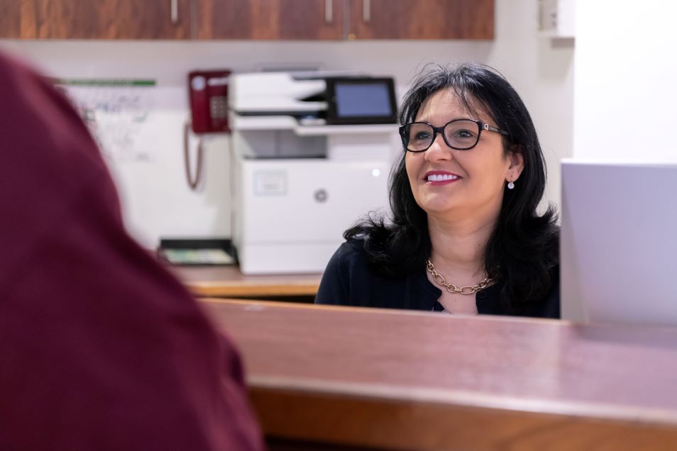 Lindo Wing receptionist smiling at a person