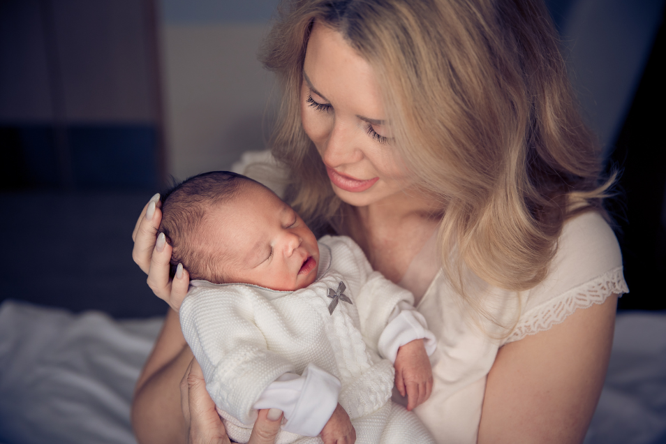 A mother holding her baby.
