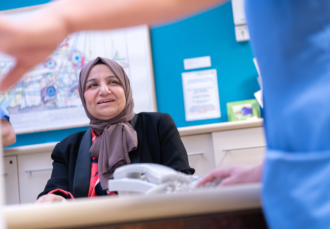 Patient at reception desk
